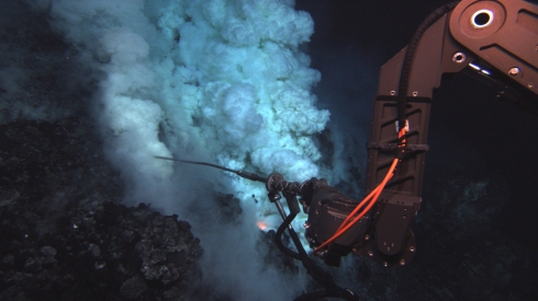 The Jason remotely-operated vehicle (ROV) samples fluid at an eruptive area near the summit of the West Mata Volcano. The fluid sampling “wand” is approximately three feet long.  Image courtesy of NSF and NOAA.